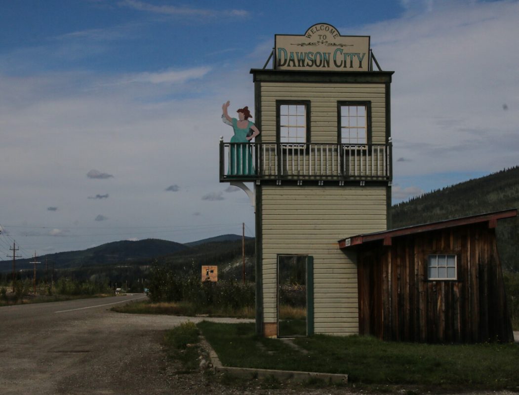 The hand-waving sign that greets visitors to Dawson City